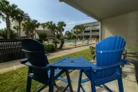 Charming 1Br Condo on the beach with pool outside back door and beach access.