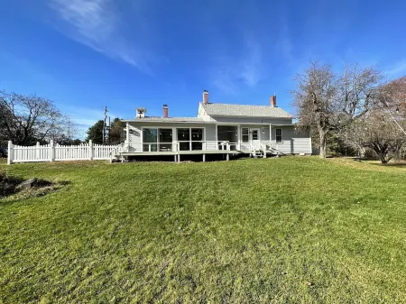 Rocky Branch Retreat on 33 acres with fenced yard, fireplaces & deck