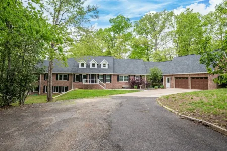 Beautiful and Private 6000 sqft waterfront home with private dock and hot tub!