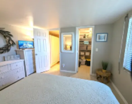 Affordable ONE BR Main Floor Condo RIGHT ON THE BEACH w/ KING Bed & Heated POOL!