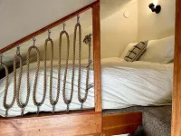 Cozy 2-bdrm dogs-welcome cabin w/ hot tub in private riverfront setting