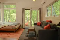 Serene Outdoor Seating and Modern Amenities - Luxurious Enchanting Cabin