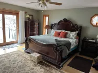 Waterfront retreat on 7 private wooded acres with beautiful sunset views.