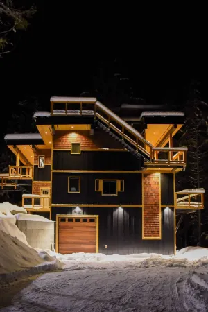 House with bridge, walk around deck, rooftop patio, 24' glass door & much more!!