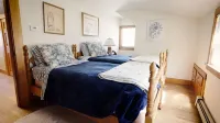 Walk to Rock Harbor Beach from your spacious Orleans coastal retreat