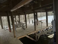 Waterfront house with boathouse, boat launch, outdoor kitchen, fire pit