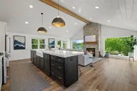 Custom Home with Lake Views + Cozy Fireplace