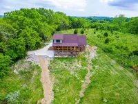 Gorgeous custom log cabin on 185 acres