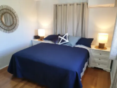Indoor/outdoor pet-friendly beach house next to world-class beach and river.