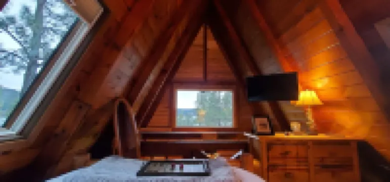 Private lakeside A-frame cabin w/ hot tub, beach, docks, games... 4 season fun!