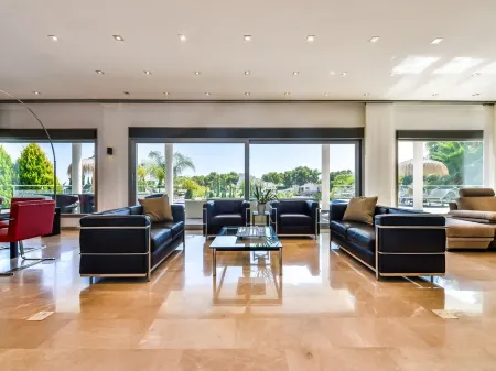 Large modern villa with indoor and outdoor pool sauna and bar.