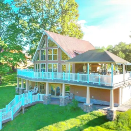 Lakehouse with covered dock, slide, and outdoor kitchen! Close to I-75, trails.