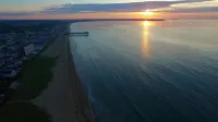 Steps to Beach and Pier Excitement - Charming Coastal Retreat