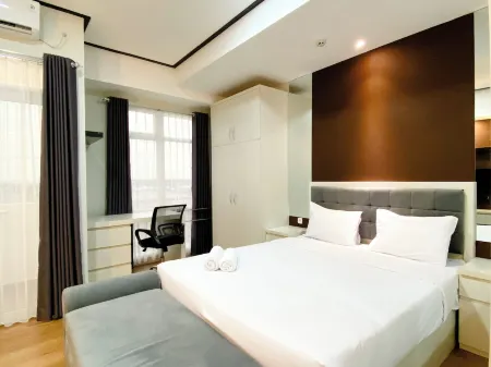 Cozy and Homey Studio at Vasanta Innopark Apartment Отели рядом с достопримечательностью «Bonecom Tricom Mm2100»