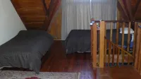 Log cabin in the mountains with indoor climbing wall, perfect for a family.