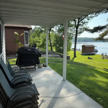 Big Pine Lakefront Retreat with Private Beach, Dock, Fire Pit & Sunset Views