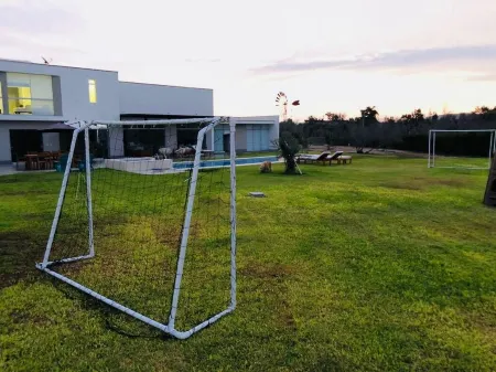 Playa Campo Ecological House of 5,500 m2 for 20 people Отели в г. Чилька