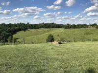 Hilltop Farmhouse with sunrise sunset porch overlooking hills and holler