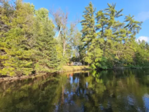 Cozy camping retreat on the banks of the beautiful AuSable River Hotels in Grayling Township