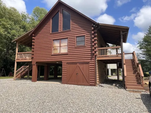 Riverfront Log Cabin with Hot Tub-Tubing on the River, Pet Friendly.