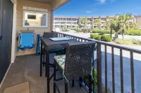 Peek of the ocean King size bed just Steps from the Beach