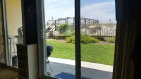 I.S.107- Charming! Ground Floor Only Steps to the Beach! Beach Service Included!