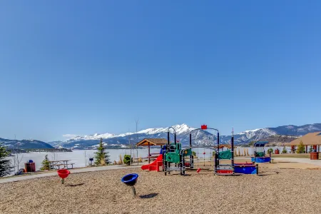 Lakefront Condo with Mountain Views & Shared Hot Tub - Walk to Town & Ski Access