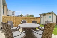 Charming Retreat with Fenced Yard and Partial Ocean Views - Cozy Escape Hotels in Lower Grand Lagoon