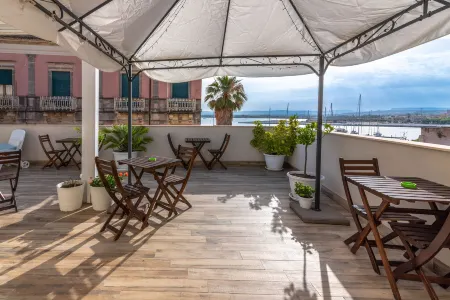 B&B Marina di Ortigia Отели рядом с достопримечательностью «Latomia del Paradiso»