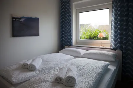 Apartment with private wooden terrace and beach chair