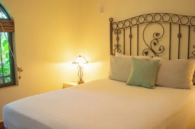 Private suite 102 with beautiful gardens, shared pool and BBQ area!