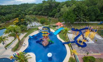 an aerial view of a water park with a large pool , slide , and other attractions at Amverton Heritage Resort