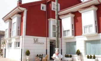 Hotel Asador H.M. Versus