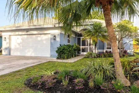 Quintessential FL Home Bursting with Color