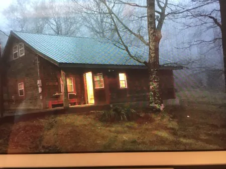 Rustic log cabin in the woods with great sunset views