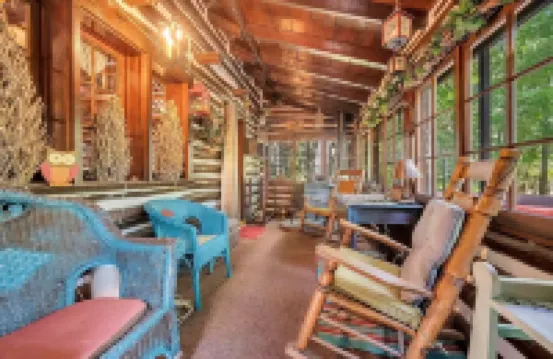 Rustic Rest Log Cabin, with hot tub and trout stream, near Poconos attractions.