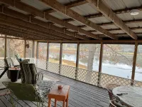 Relax at Grandma’s house with a screened in porch overlooking a private lake!