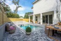 BRAND NEW 4-bedroom, 2 primary suites, heated pool, steps to the beach and river