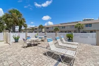 Beachfront townhome w/ on-site beach access, heated pool, patio, grill, AC, W/D