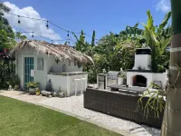 Malecon Beach House with beautiful backyard. Steps from the Caribbean ocean.