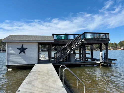 Spacious 7-bedroom, 5-bath home on 168' of a wide, deep-water cove.