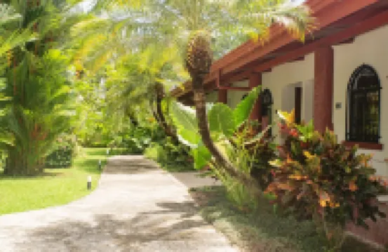 Private suite 103 with beautiful gardens, shared pool and BBQ area!