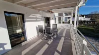 Modern, newly built vacation apartment with large covered balcony and view Hotel a Wilnsdorf