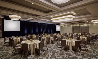 a large banquet hall with multiple round tables set for a formal event , each table having its own unique design and arrangement at Grand Hyatt Vail