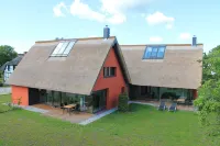 Thatched roof meets modernity, lake view; sauna, garden and much more...