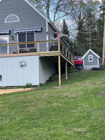 Beautiful lakefront camp with sunset view over big moose mountain