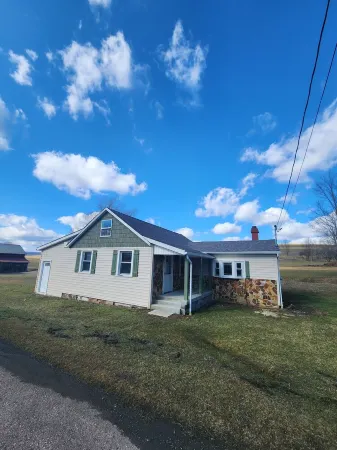 Private Home in Garrett County, surrounded by trees, fields  and farmland.