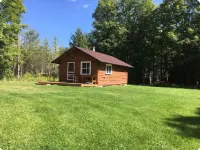 Cabin on lake with sauna - pets ok. Kayaks and boat provided.