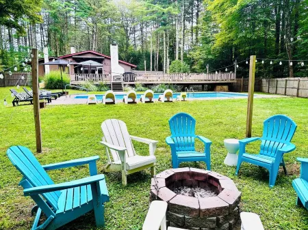 Heated pool, outdoor deck, fire pit, basketball court, fireplaces, central air.