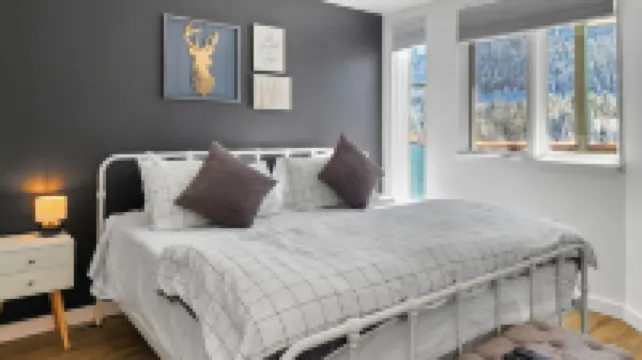 Chic Condo with Stunning Lake and Mountain Views - Inviting Escape